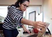 Woman working on tablet screen